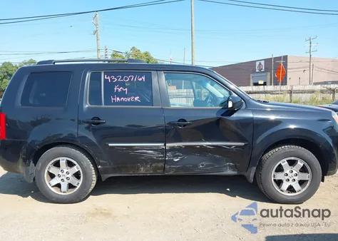 2011 Honda Pilot Touring z USA, uszkodzony, nr VIN 5FNYF4H95BB016923